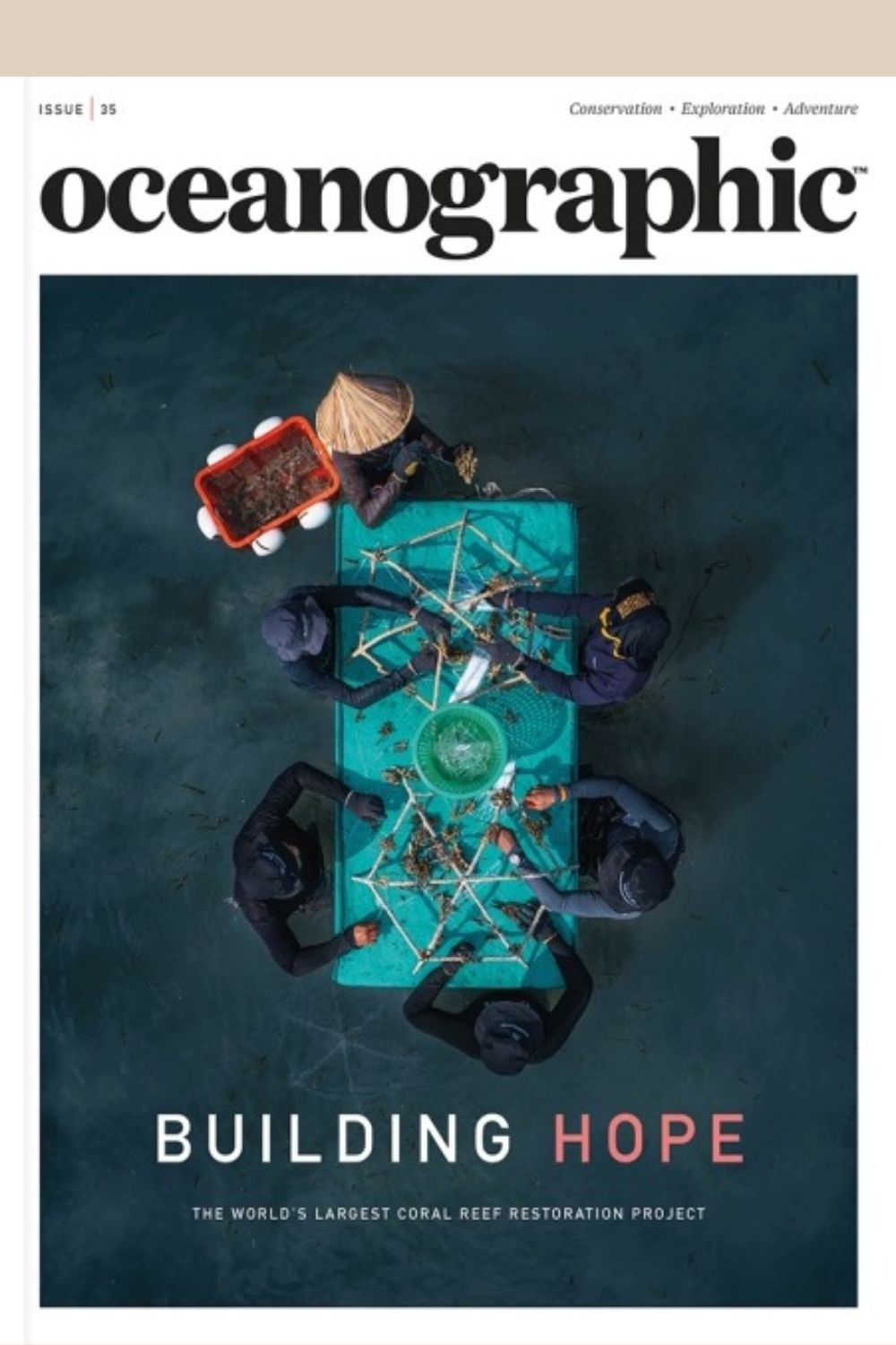 Oceanographic Magazine cover - aerial view of coral reef restoration