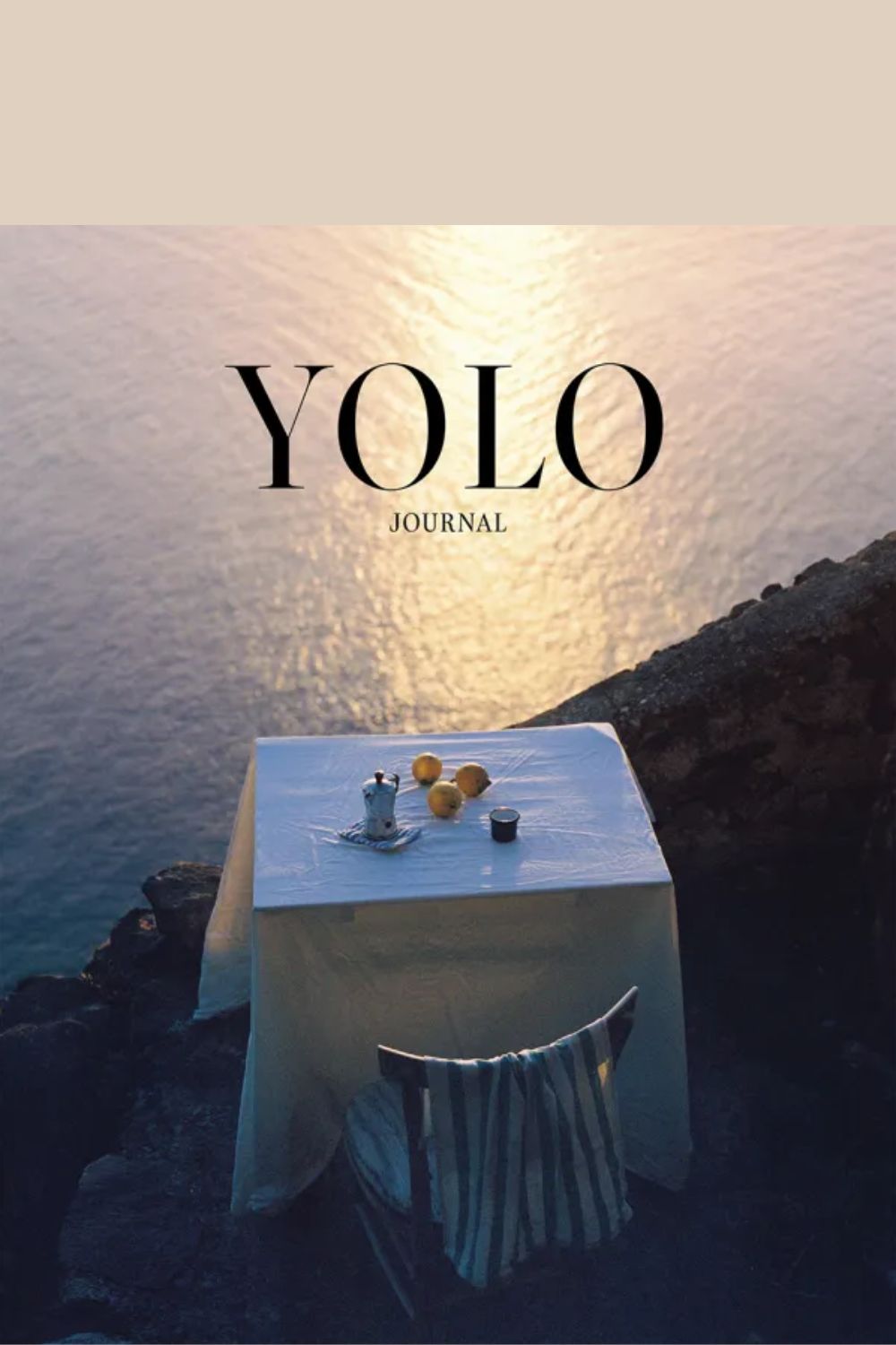 Yolo Journal Issue 15 cover (table and chair on a cliff overlooking the sea)