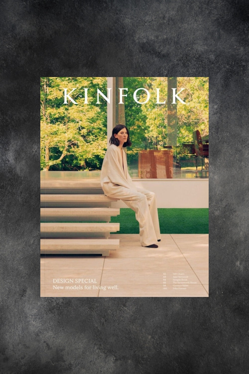 Kinfolk cover issue 51 with woman sitting on elegant stone steps