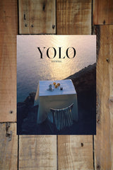 Yolo Journal Issue 15 cover (table and chair on a cliff overlooking the sea)